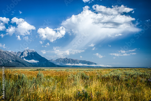 Canvas-taulu Cloud Burst Over Plain Next to Tetons