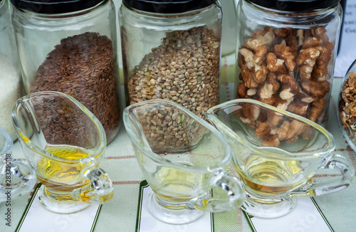 Nuts, seeds and oil pressed from them for tasting photo