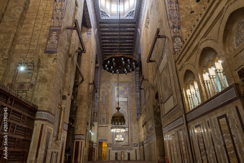 Interior of al Refai mosque with old decorated bricks stone wall and colored marble decorations, Cairo, Egypt photo