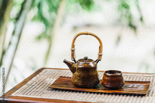 Vintage brown tea set on wooden table. Traditional tea ceremony. Eco concept.
