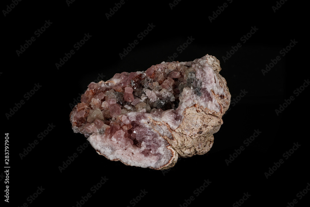 Macro mineral stone Pink Amethyst on a black background Macro mineral stone Pink Amethyst on a black background