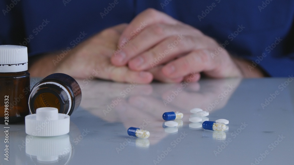 Image with a Man Suffering a Big Headache Taking Medical Pills