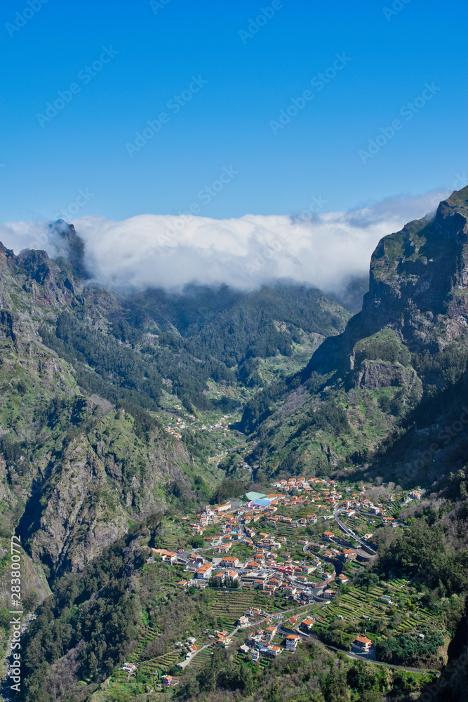 Panoramic mountains view from Eira do Serrado viewpoint down to Curral das Freiras through the Nun's Valley on Madeira Island