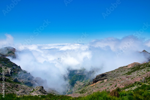 Landscape of hiking trail from Pico do Arieiro to Pico Ruivo, Madeira island, Portugal in summy summer day above the clouds