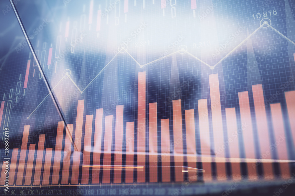 Stock market chart hologram drawn on personal computer background. Double exposure. Concept of investment. Stock market chart hologram drawn on personal computer background. Double exposure. Concept of investment.