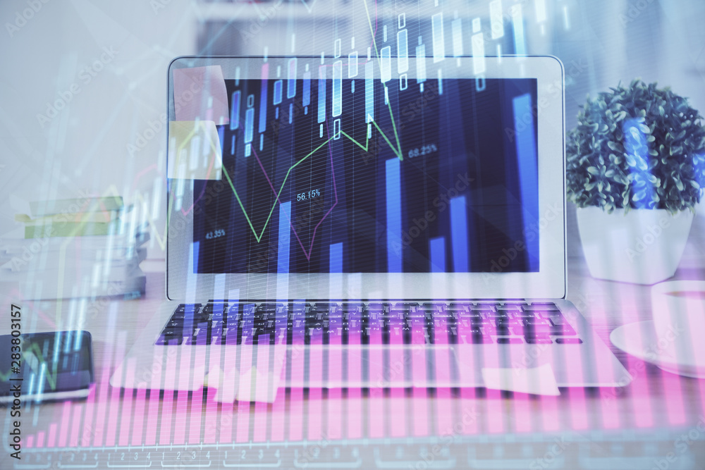 Forex market graph hologram and personal computer on background. Multi exposure. Concept of investment. Forex market graph hologram and personal computer on background. Multi exposure. Concept of investment.