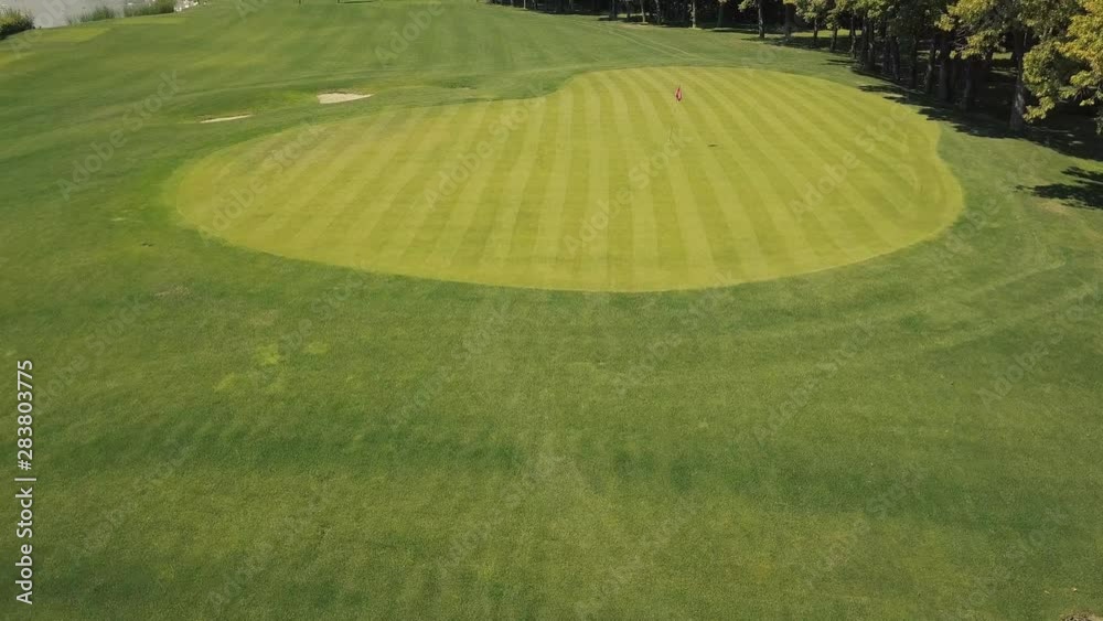 Aerial view. Golf course with green grass and water. A place for recreation, sports and entertainment Aerial view. Golf course with green grass and water. A place for recreation, sports and entertainment