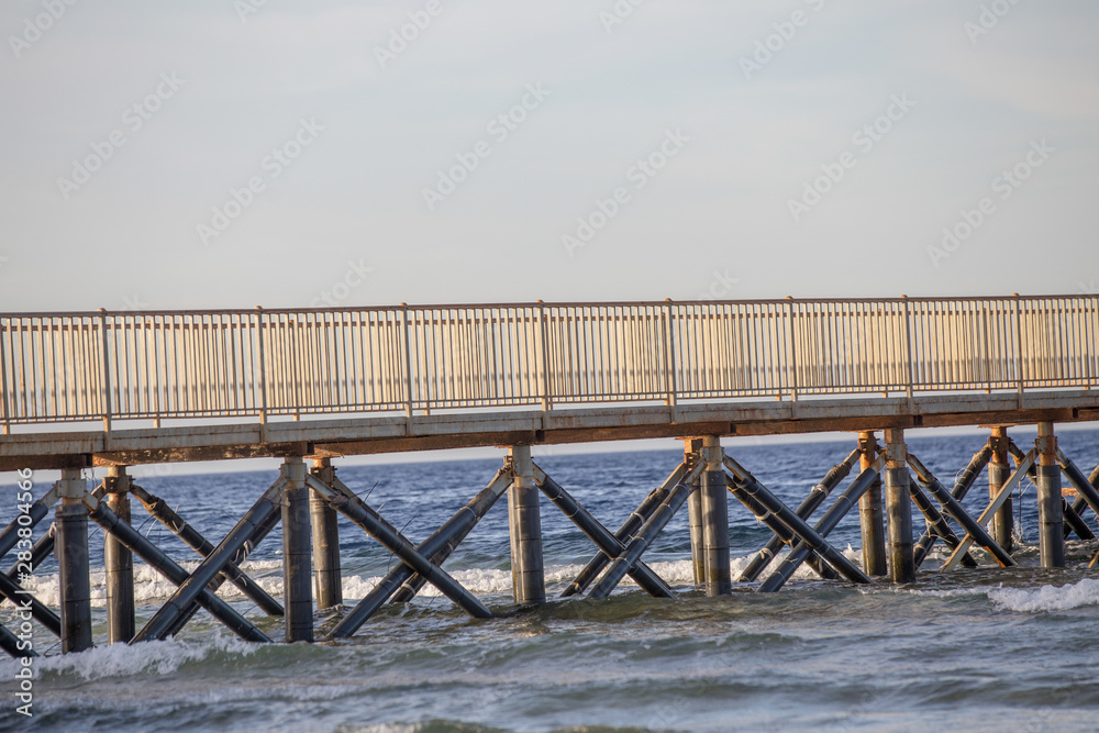 Wooden pier on the sea summer background