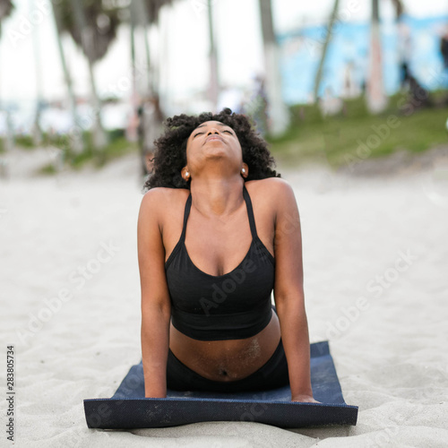 Eye level view of woman in cobra yoga pose