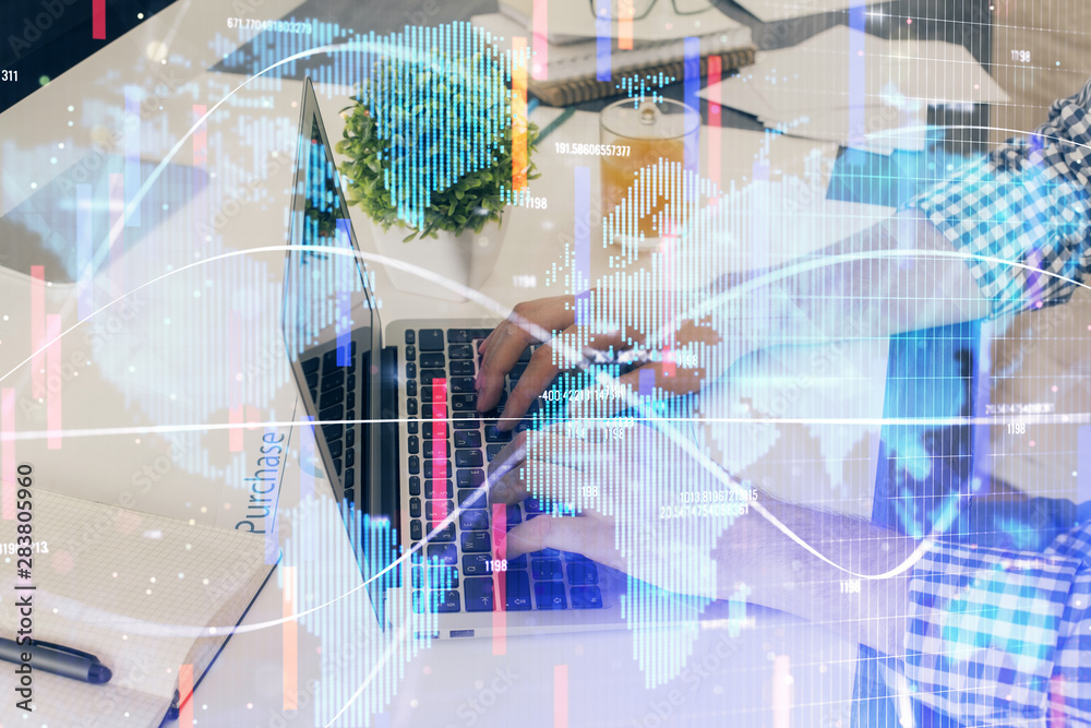 Double exposure of businessman working on laptop on background. International business hologram in front. Concept of success.