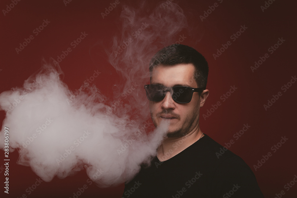 Vaping man and a cloud of vapor Vaping man and a cloud of vapor