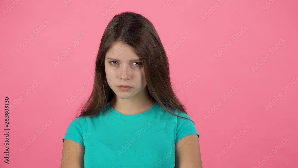 Cute female is changing her mood. Firtly she is angree disagree and then happy. Slow motion Cute female is changing her mood. Firtly she is angree disagree and then happy. Slow motion