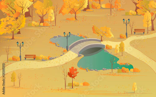 Autumn landscape path in the forest with a bridge over the pond. Beautiful scenery with golden colors