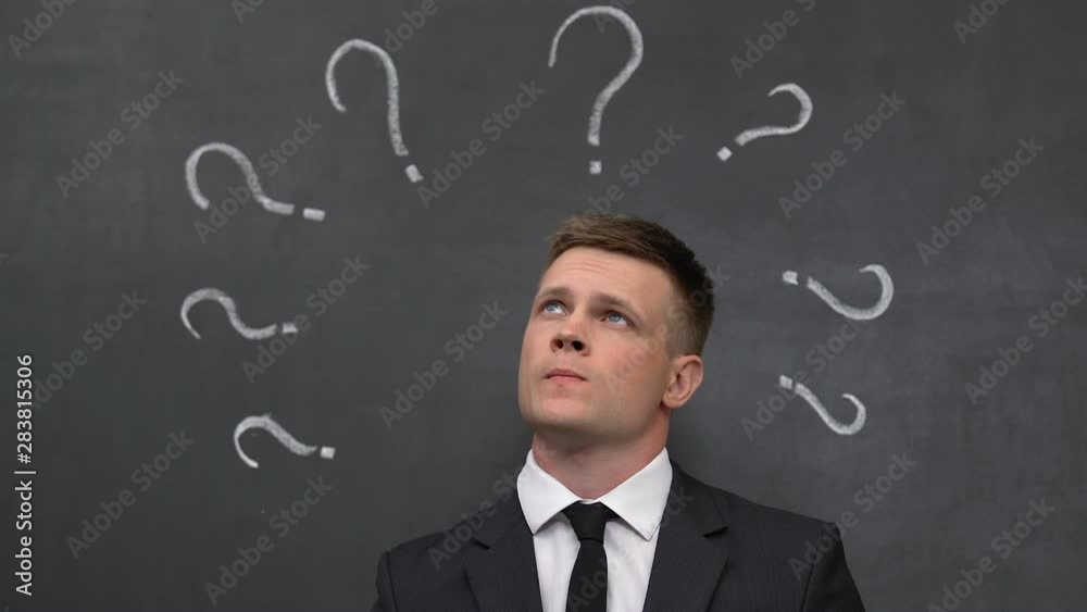Male in businesswear thinking, developing startup, considering options, career Male in businesswear thinking, developing startup, considering options, career