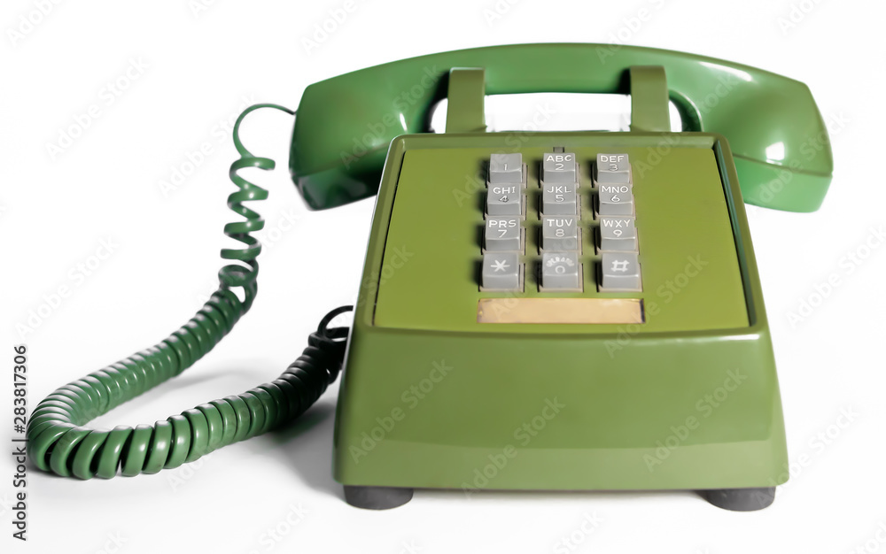 Retro push button rotary dial telephone. Vintage avocado green
