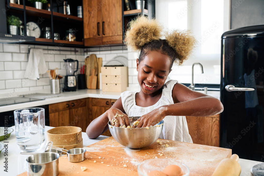 Cute Little African American Girl Making Cookies at Home Kitchen Stock  Photo