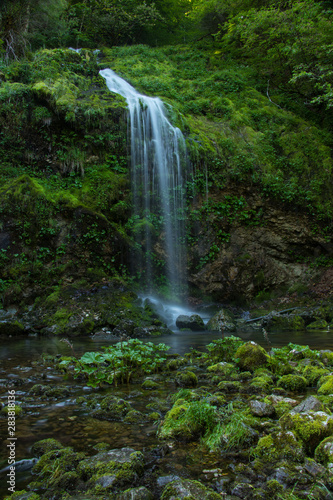 Beautiful green colorful small waterfall