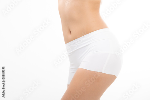 Close up beautiful fit woman slim body in white panties isolated on white background
