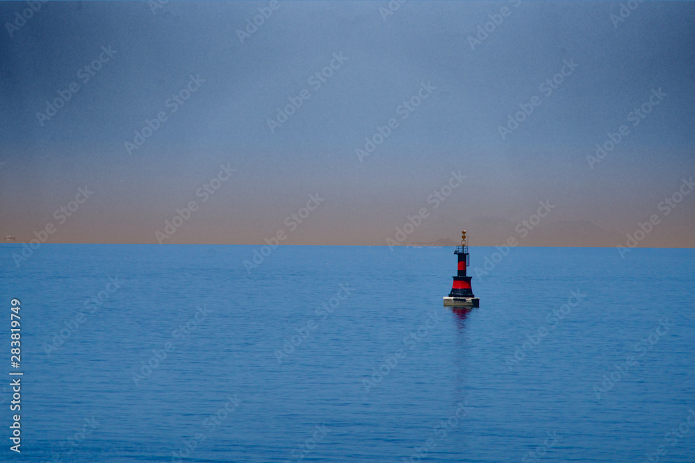 red-black buoy in the evening red-black buoy in the evening