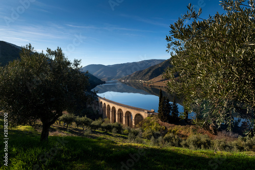 Scenic view of the Douro River with terraced vineyards near the village of Foz Coa, in Portugal; Concept for travel in Portugal and most beautiful places in Portugal photo