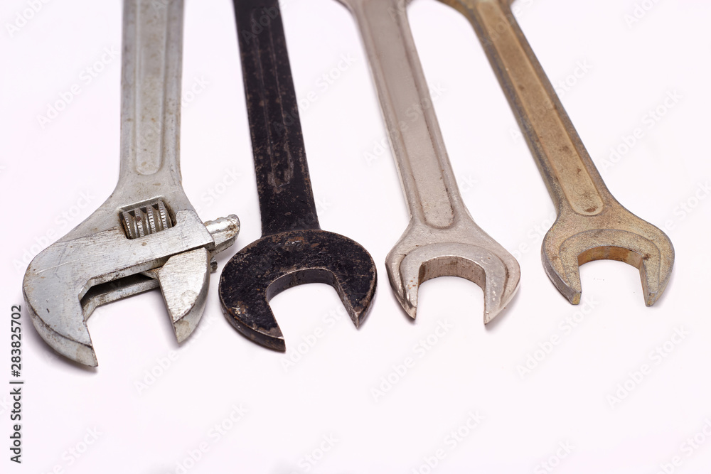 Old rusty wrenches, spanners set isolated on white.
