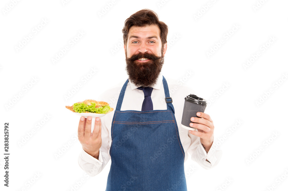 Enjoy your meal. Guy serving croissant stuffed lettuce and fresh vegetables. Healthy food. Delicious croissant. Man bearded waiter wear apron carry plate with food and coffee cup. Cafe food concept Enjoy your meal. Guy serving croissant stuffed lettuce and fresh vegetables. Healthy food. Delicious croissant. Man bearded waiter wear apron carry plate with food and coffee cup. Cafe food concept