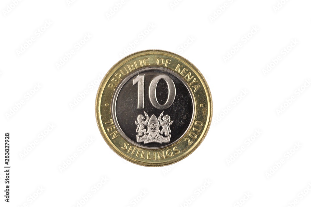 A bimettalic, ten Kenyan shilling coin isolated on a white background, shot in close up macro A bimettalic, ten Kenyan shilling coin isolated on a white background, shot in close up macro