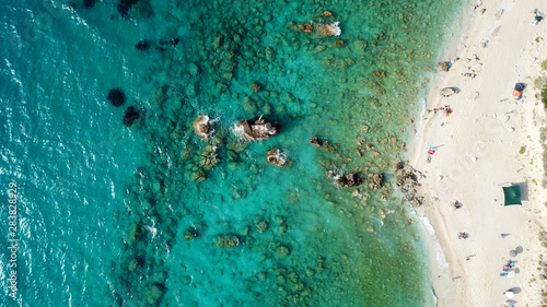 Aerial drone bird's eye view photo of tropical caribbean paradise rockybay with turquoise clear sea