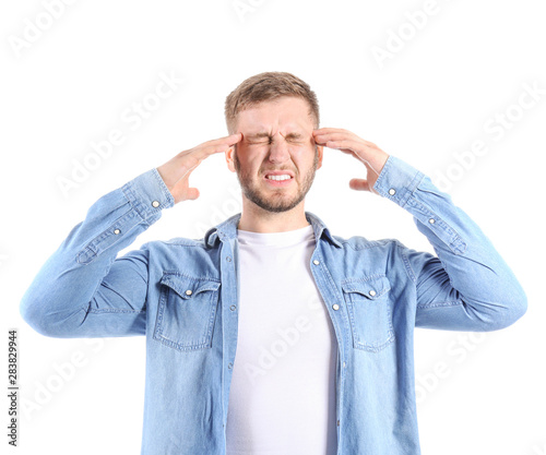 Stressed young man on white...