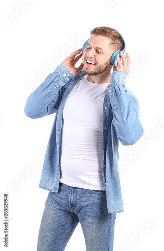 Handsome young man listenin...