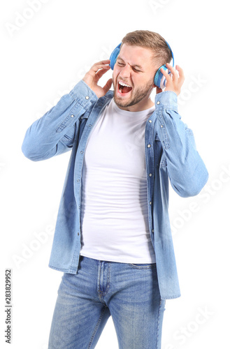 Handsome young man listenin...