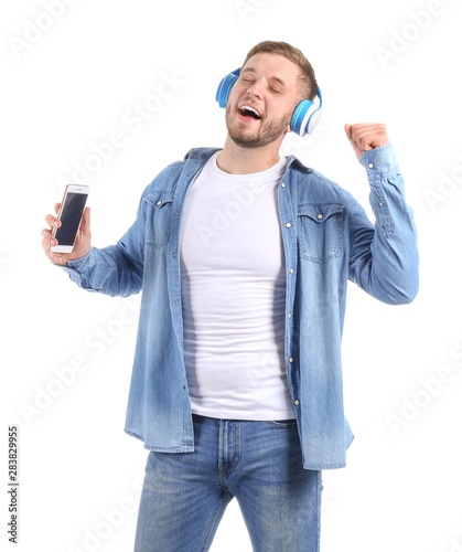 Handsome young man listenin...