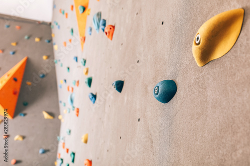 Wall with climbing holds in...