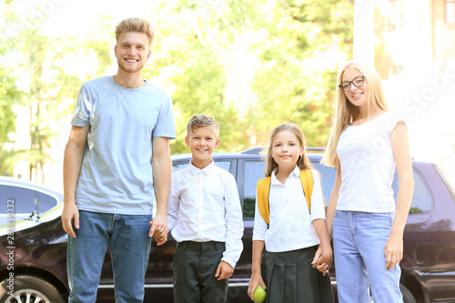 Parents with their little c...