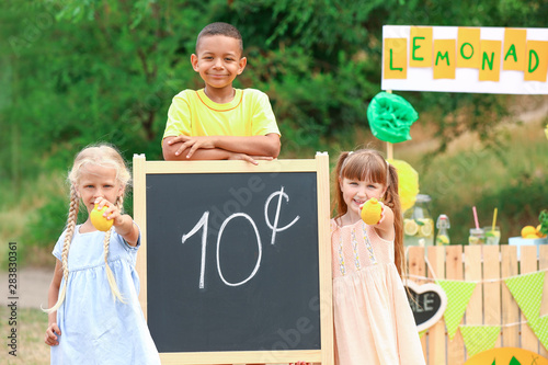 Cute little children sellin...