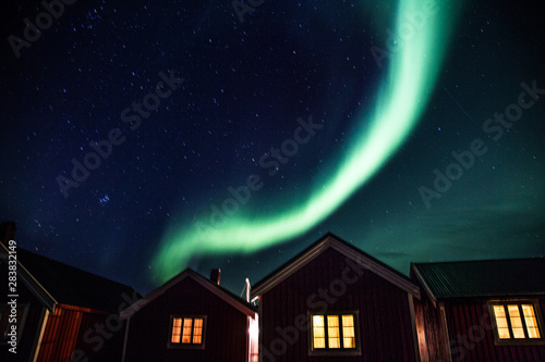 Northern lights above Reine in Lofoten islands in Norway