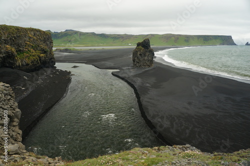 Fototapeta Naklejka Na Ścianę i Meble -  View of the black sand beach and the sea in Iceland