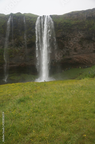 Waterfall in Iceland where visitors can walk behind