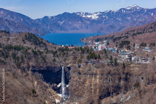 High angle view of lake Chuzenji, Kegon falls and mountain range at the Akechidaira observatory deck. photo