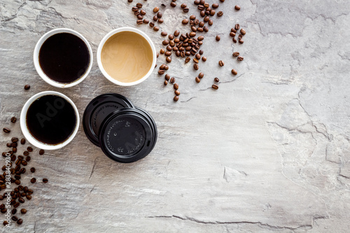 Coffee to go on gray backound top view mockup photo