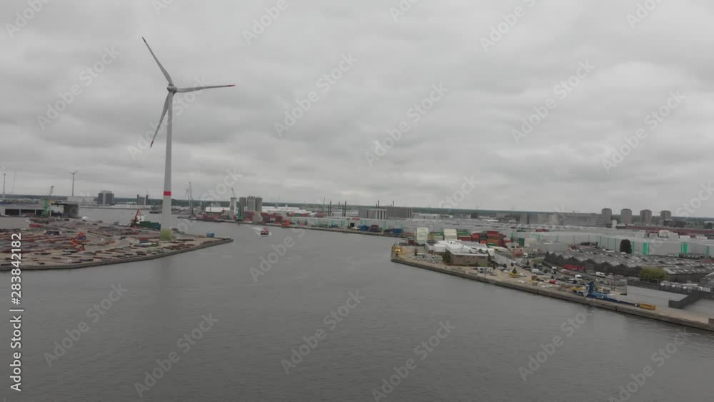 Wind turbines in Antwerp port on sunset. Antwerp, Belgium Wind turbines in Antwerp port on sunset. Antwerp, Belgium