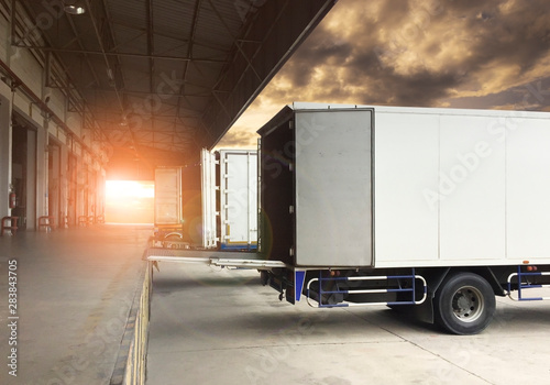 Cargo truck parked loading at dock warehouse Fototapete