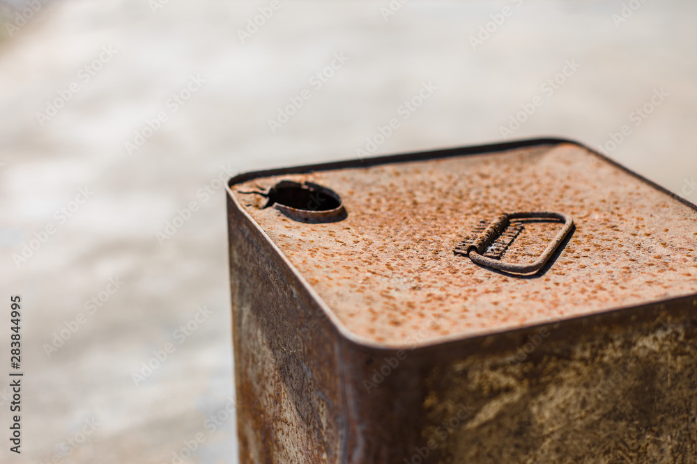 Rusted steel bucket on concrete floor Rusted steel bucket on concrete floor