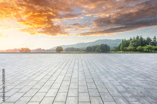 Empty floor and green woods with mountain natural scenery in city park