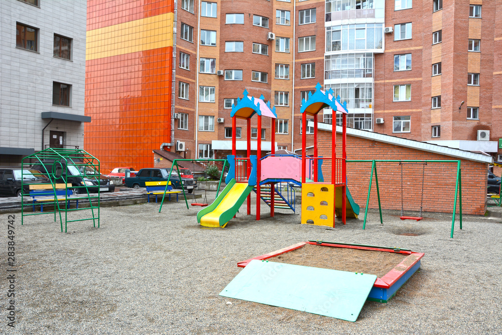 Children's playground in the courtyard of the apartment building. Russia. Siberia. Summer Children's playground in the courtyard of the apartment building. Russia. Siberia. Summer