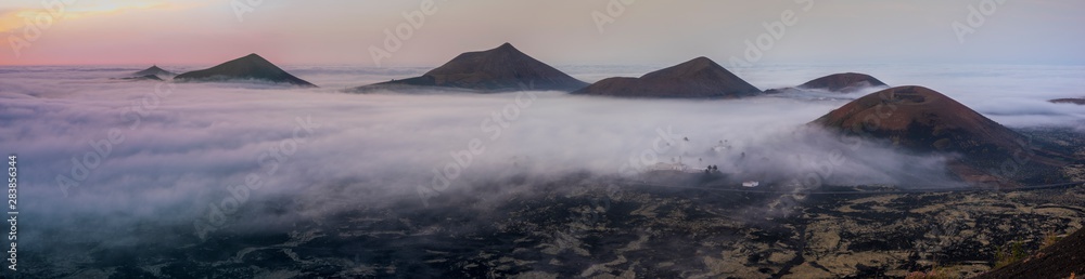 Lanzarote volcanic landscape shrouded in morning mists