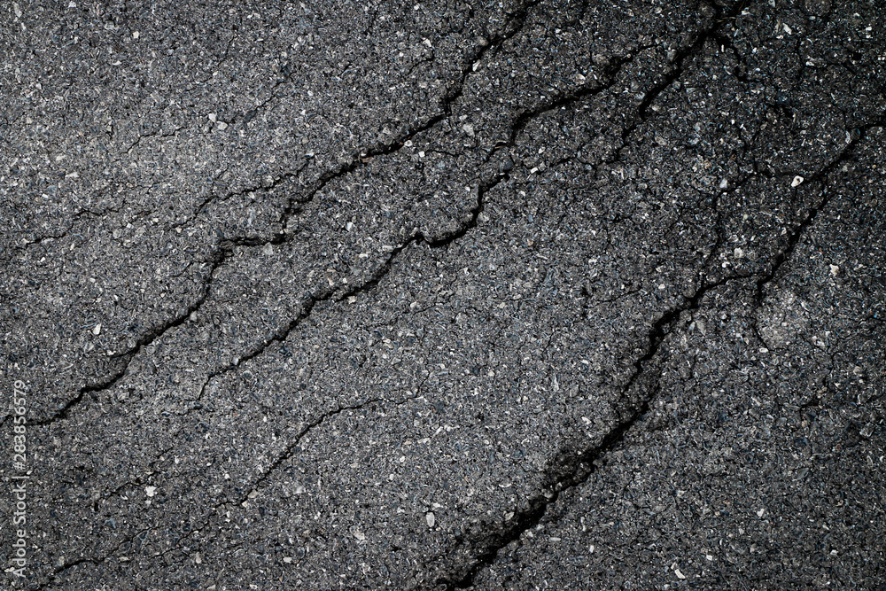 Fototapeta premium dark asphalt crack by earthquake