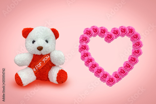 Bear doll sitting with pink background
