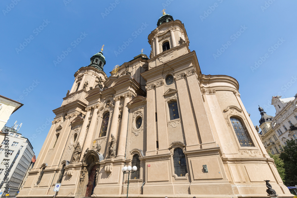 Front of the Church of Saint Nicholas in the Old Town (Stare Mesto) of Prague in Czech Republic, on a sunny day.