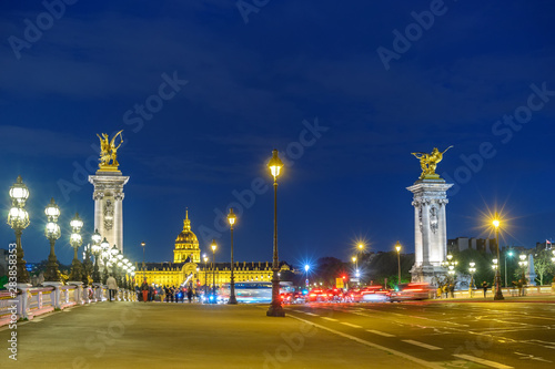 Paris France city skyline night at Seine River with Pont Alexandre III bridge